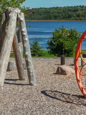 Wooden playground structure and sand area overlooking Ritchie Lake.